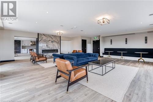 15 Glebe Street Unit# 1813, Cambridge, ON - Indoor Photo Showing Living Room With Fireplace