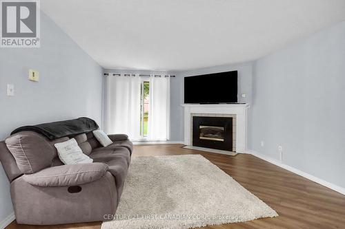 14 - 140 Conway Drive, London, ON - Indoor Photo Showing Living Room With Fireplace