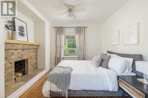 58 West Lynn Avenue, Toronto, ON - Indoor Photo Showing Bedroom With Fireplace