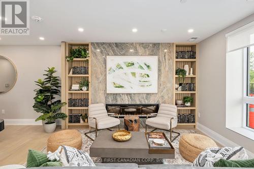 Residents Lounge - 110 - 1560 Upper West Avenue, London, ON - Indoor Photo Showing Living Room With Fireplace