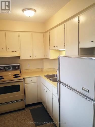 1-303 - 50 Old Kingston Road, Toronto, ON - Indoor Photo Showing Kitchen With Double Sink