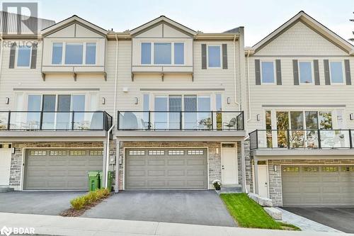 Rear view of townhouse - 73C Bridge Street E, Picton, ON - Outdoor With Balcony With Facade