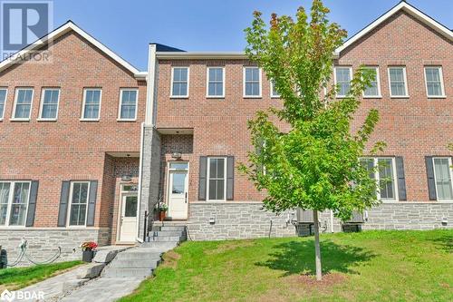 Front/ street  entrance of townhouse - 73C Bridge Street E, Picton, ON - Outdoor With Facade