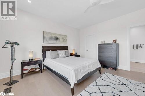 Primary bedroom walk-in closet - 73C Bridge Street E, Picton, ON - Indoor Photo Showing Bedroom