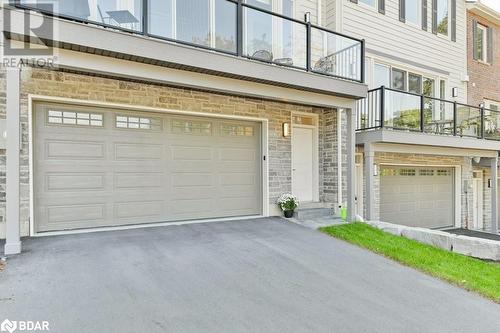 Double car garage - 73C Bridge Street E, Picton, ON - Outdoor With Balcony