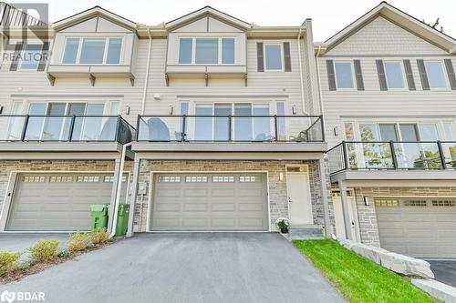 Rear view of townhouse - 73C Bridge Street E, Picton, ON - Outdoor With Balcony With Facade