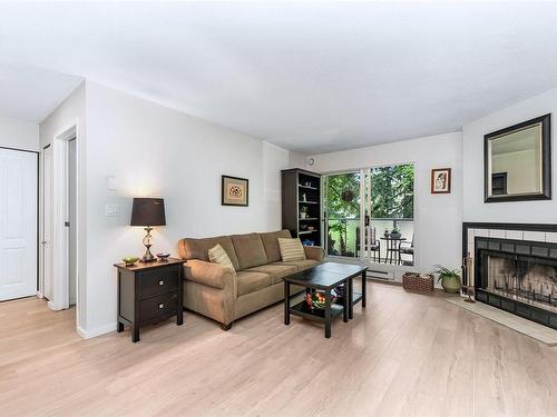 212-2520 Wark St, Victoria, BC - Indoor Photo Showing Living Room With Fireplace