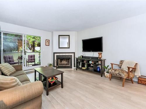 212-2520 Wark St, Victoria, BC - Indoor Photo Showing Living Room With Fireplace