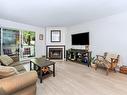 212-2520 Wark St, Victoria, BC  - Indoor Photo Showing Living Room With Fireplace 