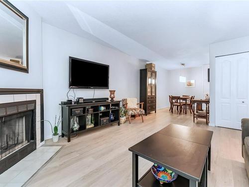 212-2520 Wark St, Victoria, BC - Indoor Photo Showing Living Room With Fireplace