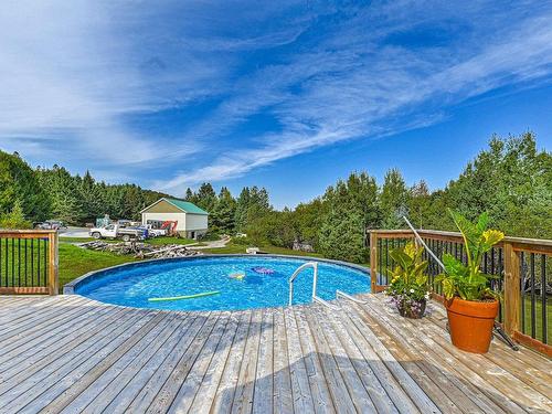 Terrasse - 359  - 363 Ch. Avila, Piedmont, QC - Outdoor With Above Ground Pool With Backyard