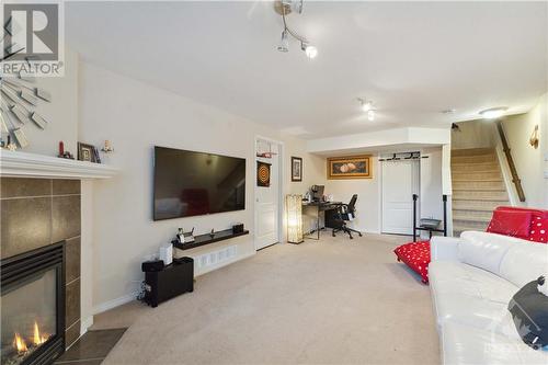 1436 Comfrey Crescent, Ottawa, ON - Indoor Photo Showing Living Room With Fireplace