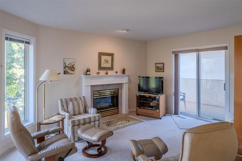 145-1634 Carmi Avenue, Penticton, BC - Indoor Photo Showing Living Room With Fireplace