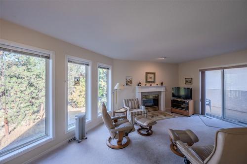 145-1634 Carmi Avenue, Penticton, BC - Indoor Photo Showing Living Room With Fireplace