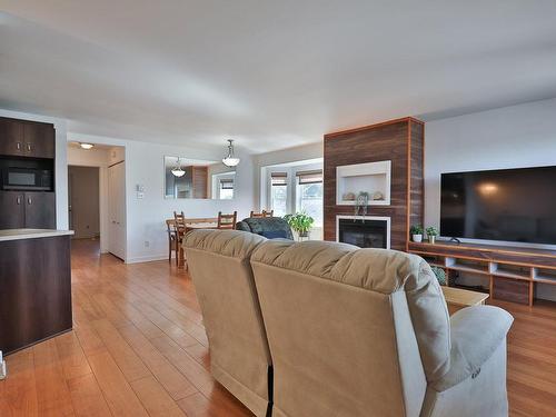 Salon - 202-12590 Rue Sherbrooke E., Montréal (Rivière-Des-Prairies/Pointe-Aux-Trembles), QC - Indoor Photo Showing Living Room With Fireplace