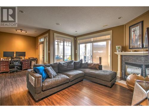 8764 Hofer Drive, Coldstream, BC - Indoor Photo Showing Living Room With Fireplace