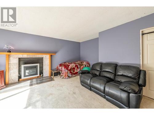 9905 6 Highway, Salmo, BC - Indoor Photo Showing Living Room With Fireplace