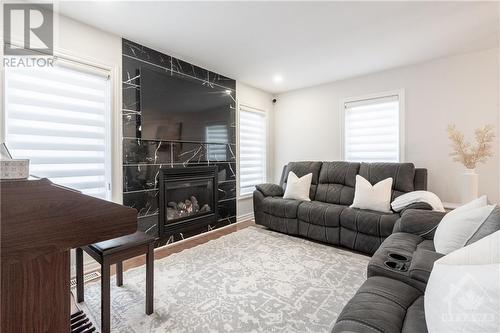 Living Room - 658 Paul Metivier Drive, Ottawa, ON - Indoor Photo Showing Living Room With Fireplace