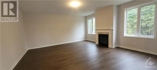 Family Room with Gas fireplace - 82 Green Ash Avenue, Ottawa, ON - Indoor With Fireplace