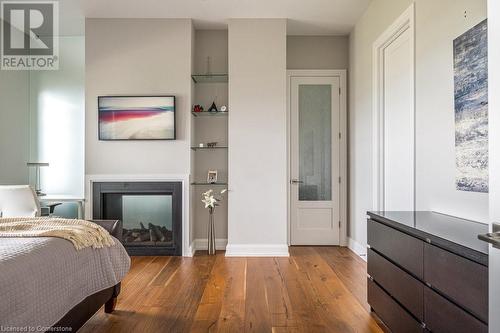 Door To Balcony, Fireplace and Walk-In Closet - 147 Mountain Park Avenue, Hamilton, ON - Indoor Photo Showing Bedroom With Fireplace