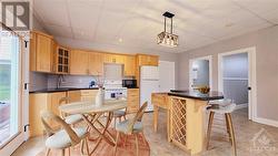 Virtually StagedWalkout Level In-law Suite - Granite kitchen with Island - 