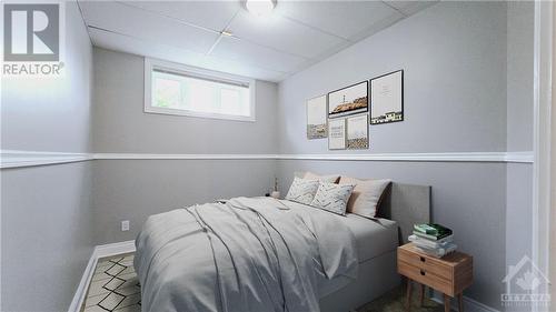 Virtually Staged Walkout Level In-law Suite - Bedroom #2 - 103 Lady Slipper Way, Carp, ON - Indoor Photo Showing Bedroom