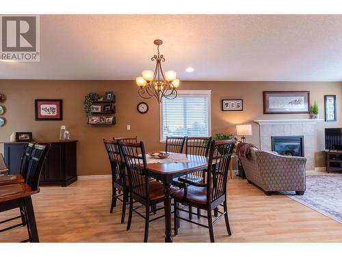 4686 Gray Drive, Prince George, BC - Indoor Photo Showing Dining Room With Fireplace