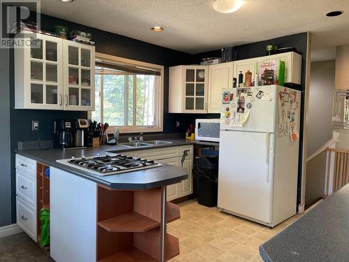 5508 53 Street, Fort Nelson, BC - Indoor Photo Showing Kitchen With Double Sink