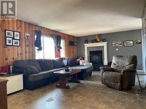 5508 53 Street, Fort Nelson, BC - Indoor Photo Showing Living Room With Fireplace