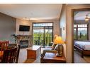 303 - 1549 Kicking Horse Trail, Golden, BC  - Indoor Photo Showing Living Room With Fireplace 