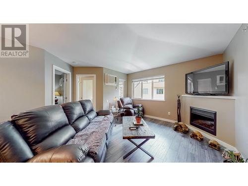 921 Spillway Road Unit# 309A, Oliver, BC - Indoor Photo Showing Living Room With Fireplace