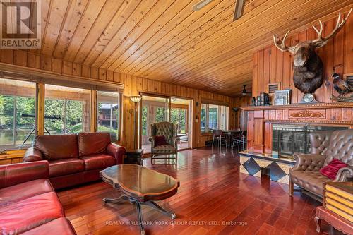 1663 Horseshoe Lake Road, Minden Hills, ON - Indoor Photo Showing Living Room With Fireplace