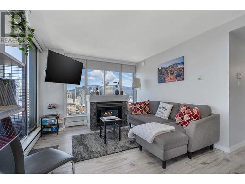 3001 183 Keefer Place, Vancouver, BC - Indoor Photo Showing Living Room With Fireplace