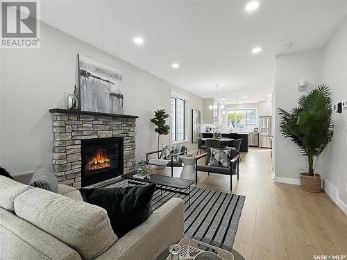 1112 9Th Street E, Saskatoon, SK - Indoor Photo Showing Living Room With Fireplace