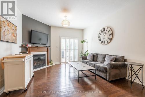 39 - 310 Southbrook Drive, Hamilton, ON - Indoor Photo Showing Living Room With Fireplace