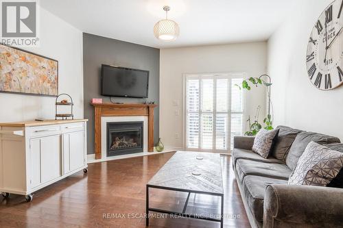 39 - 310 Southbrook Drive, Hamilton, ON - Indoor Photo Showing Living Room With Fireplace