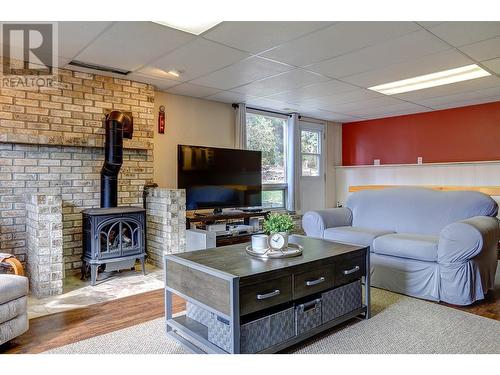 7697 Silver Star Road, Vernon, BC - Indoor Photo Showing Living Room With Fireplace