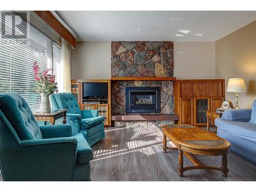 7697 Silver Star Road, Vernon, BC - Indoor Photo Showing Living Room With Fireplace