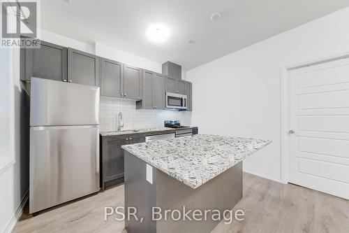 202 - 3285 Carding Mill Trail, Oakville, ON - Indoor Photo Showing Kitchen With Stainless Steel Kitchen With Upgraded Kitchen