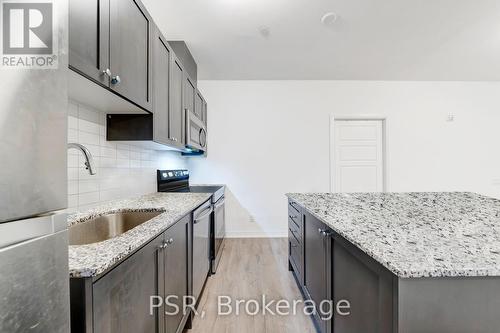 202 - 3285 Carding Mill Trail, Oakville, ON - Indoor Photo Showing Kitchen With Upgraded Kitchen