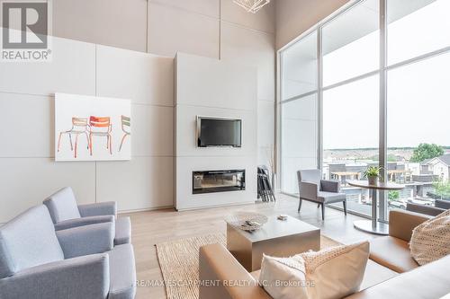 301 - 3028 Creekshore Common, Oakville, ON - Indoor Photo Showing Living Room With Fireplace