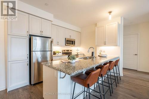 301 - 3028 Creekshore Common, Oakville, ON - Indoor Photo Showing Kitchen With Stainless Steel Kitchen With Double Sink With Upgraded Kitchen