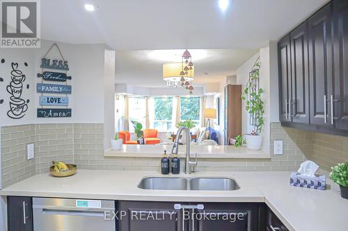 412 - 325 Webb Drive, Mississauga, ON - Indoor Photo Showing Kitchen With Double Sink