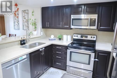 412 - 325 Webb Drive, Mississauga, ON - Indoor Photo Showing Kitchen With Double Sink