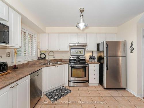 13-5530 Glen Erin Dr, Mississauga, ON - Indoor Photo Showing Kitchen With Double Sink