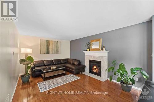 22 Collingwood Crescent, Ottawa, ON - Indoor Photo Showing Living Room With Fireplace