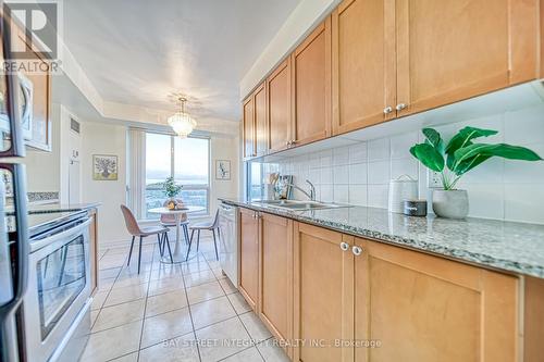 603 - 4889 Kimbermount Avenue, Mississauga, ON - Indoor Photo Showing Kitchen With Double Sink