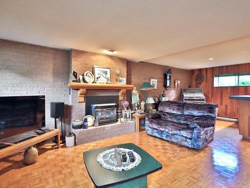 Family room - 5095 Rue Jolliet, Saint-Hyacinthe, QC - Indoor Photo Showing Living Room With Fireplace