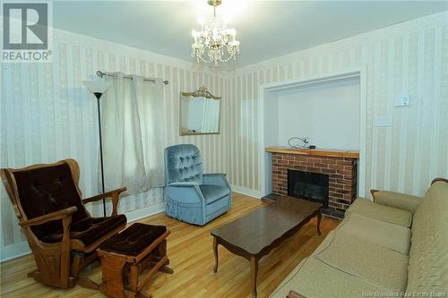 252 Bridge Street, Chipman, NB - Indoor Photo Showing Living Room With Fireplace