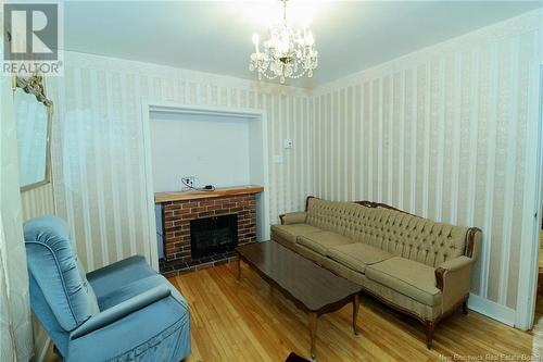 252 Bridge Street, Chipman, NB - Indoor Photo Showing Living Room With Fireplace